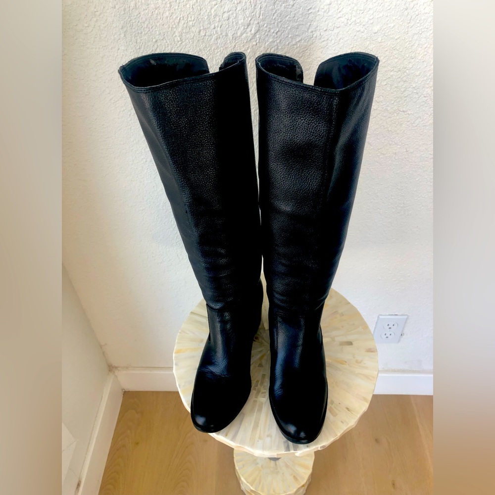 Tall black leather boots